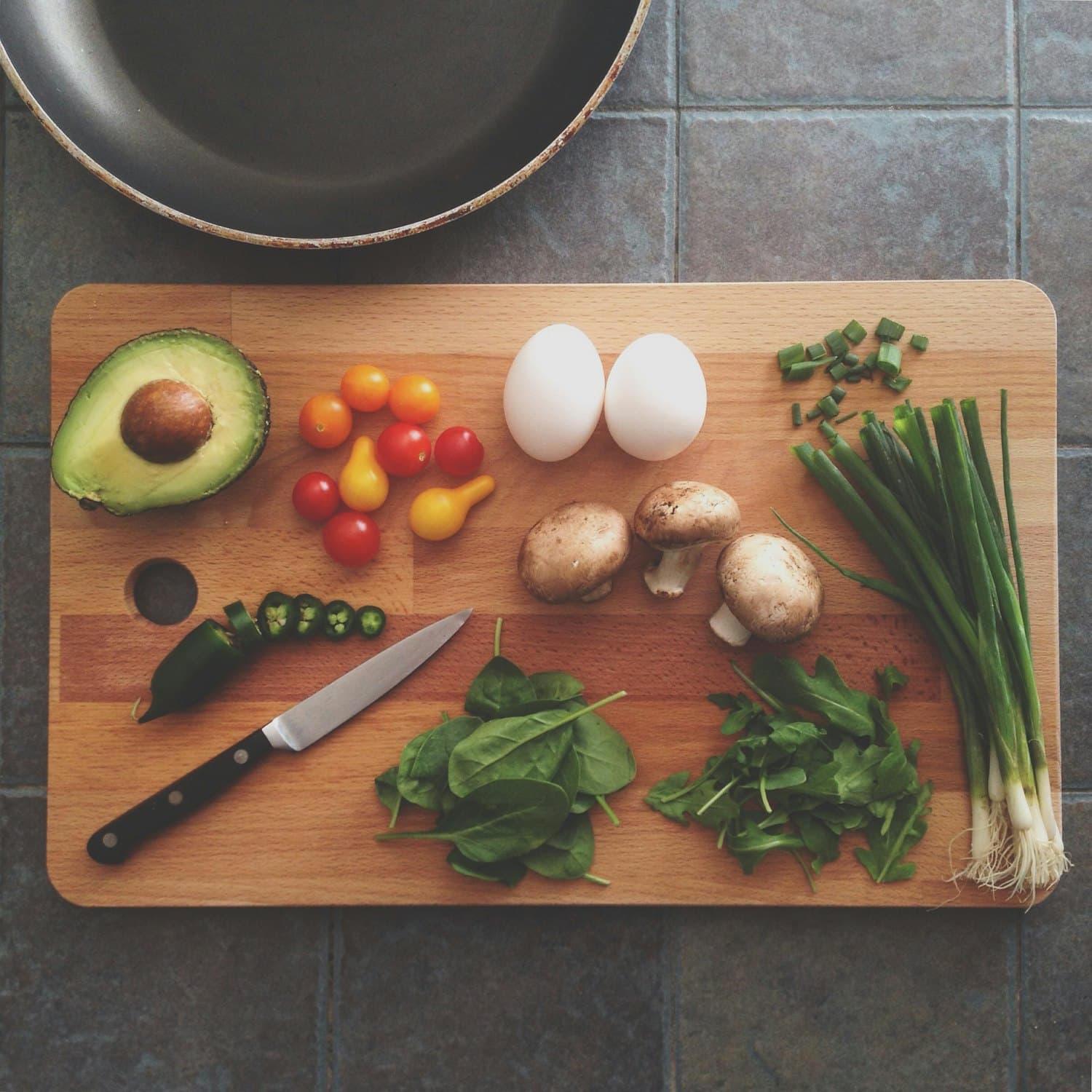 Fresh ingredients laid out on a wooden cutting board