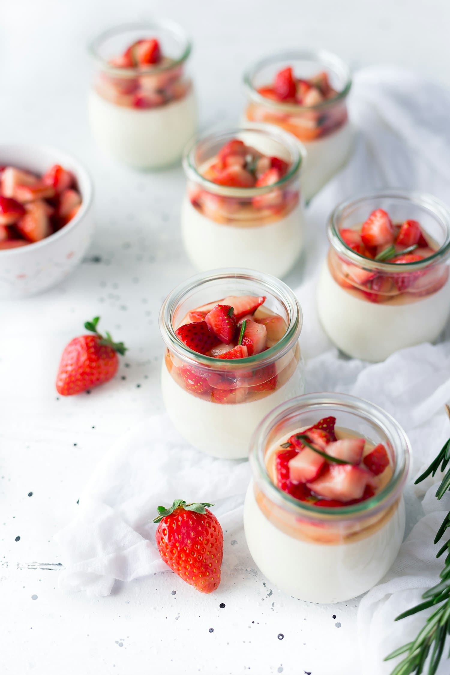Layered yoghurt bowls topped with fruit and granola
